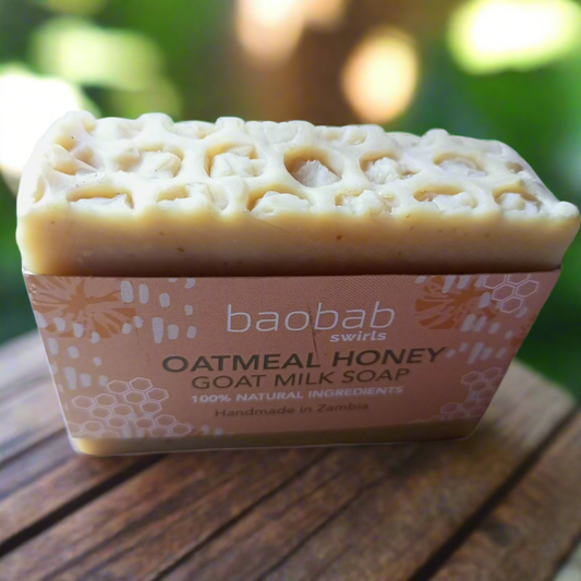 Handcrafted goat milk soap with AHAs for gentle skin exfoliation and hydration.