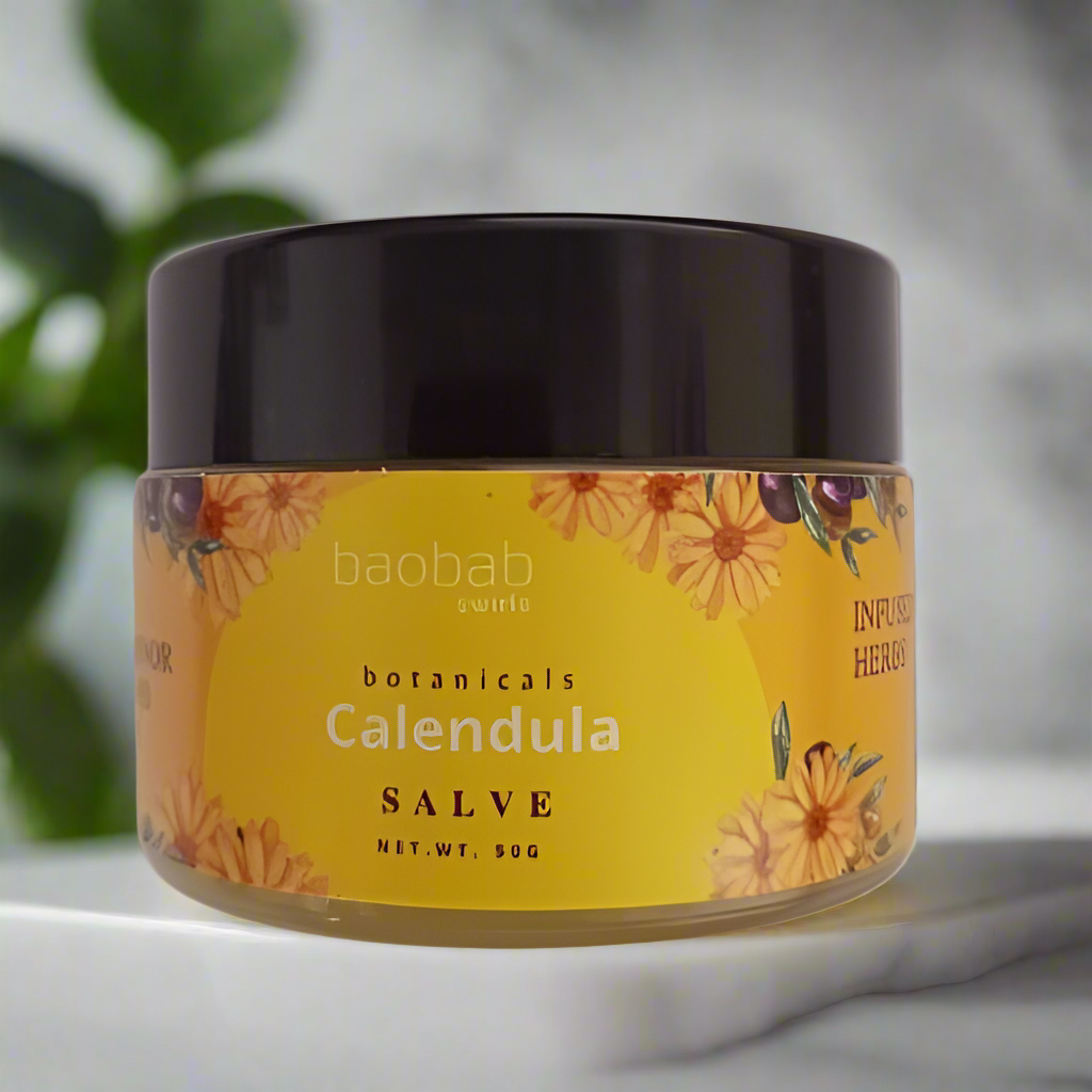 Calendula salve jar on a bathroom counter with green plant leaves in background 